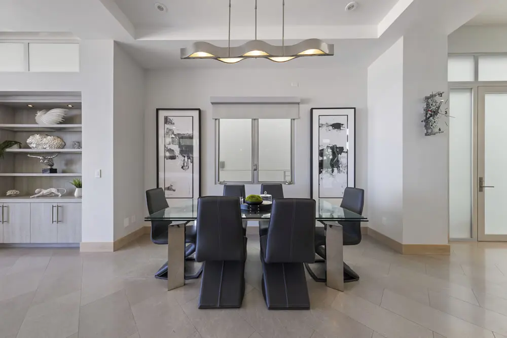 Modern dining area with glass table and contemporary decor at 212 The Strand