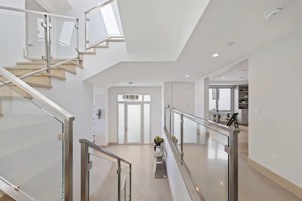 Elegant entryway view from staircase at 212 The Strand beach home
