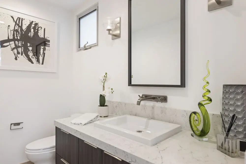 Stylish bathroom with marble countertop and modern fixtures at 212 The Strand
