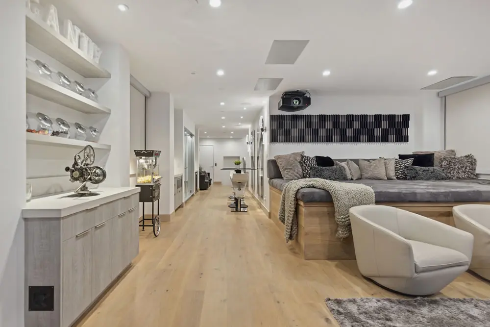 Lower level entertainment area and hallway at 212 The Strand