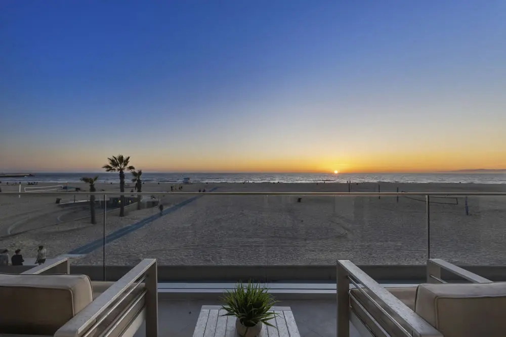 Oceanfront sunset view from master bedroom at 212 The Strand
